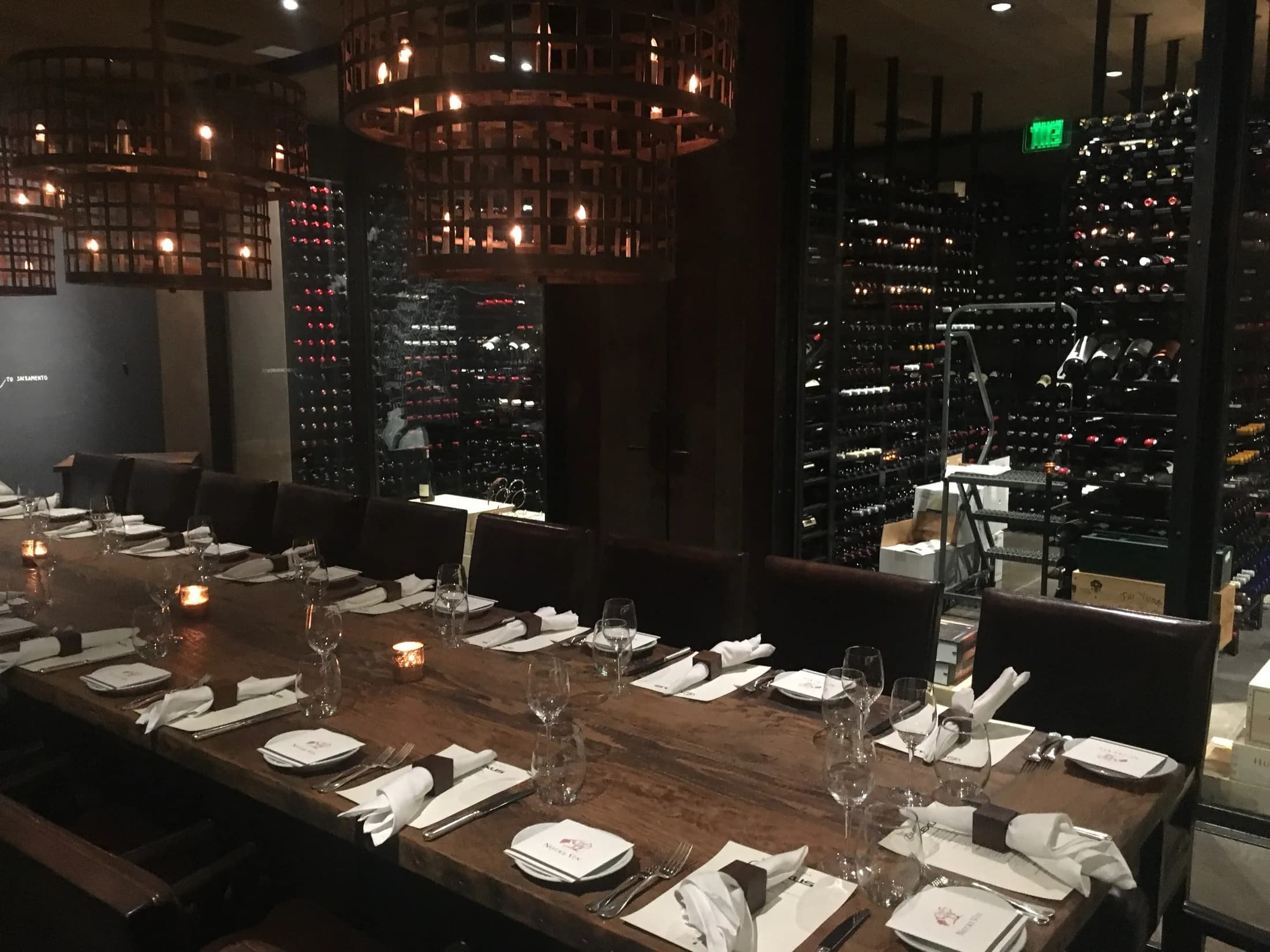 A private cellar dining room set for an intimate wine dinner.